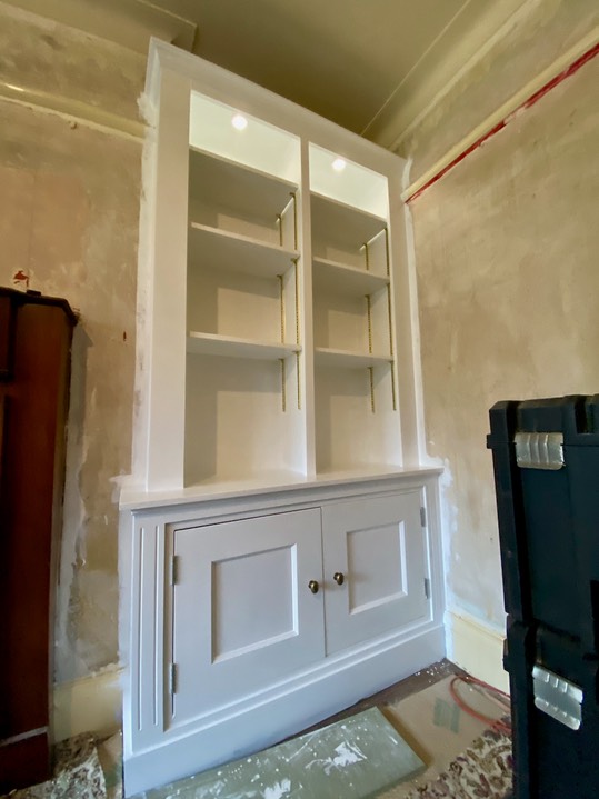 white alcove units with beaded doors